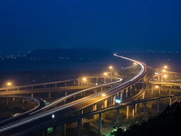 Night highway interchange representing coast to coast freight lanes